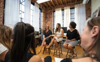 women-sitting-on-chairs-inside-a-room-3719037